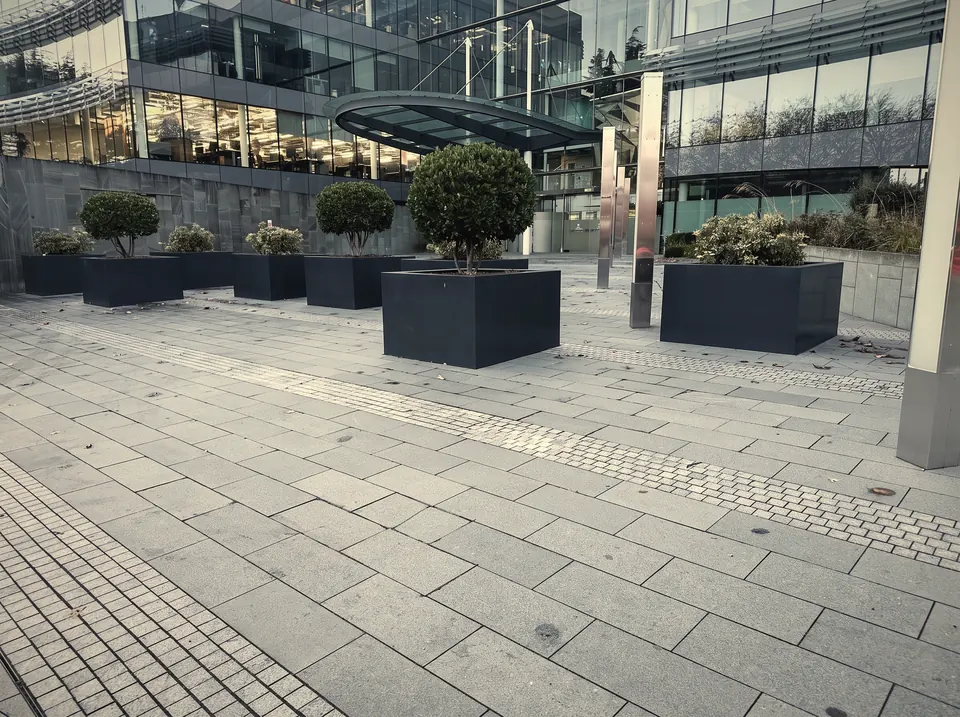 Anthracite powder coated planters in a commercial plaza